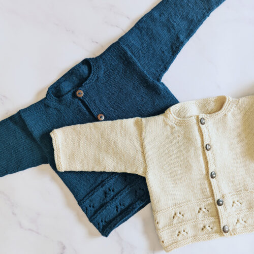 Blue and cream box style knitted cardigan for baby and toddler with eyelet detail