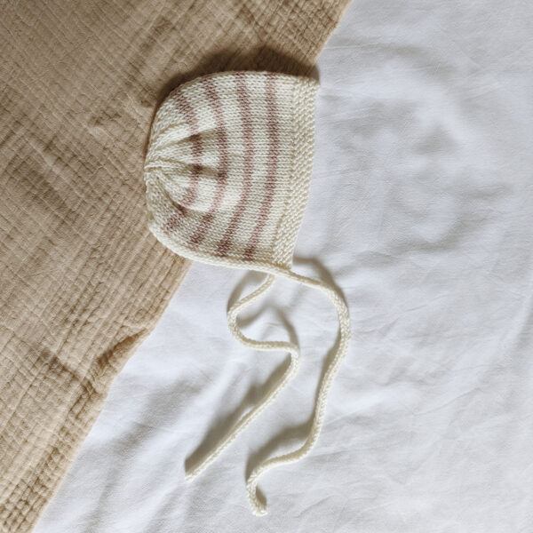 Sutton Baby Bonnet - knitted baby bonnet with pink stripes and i-cord tie