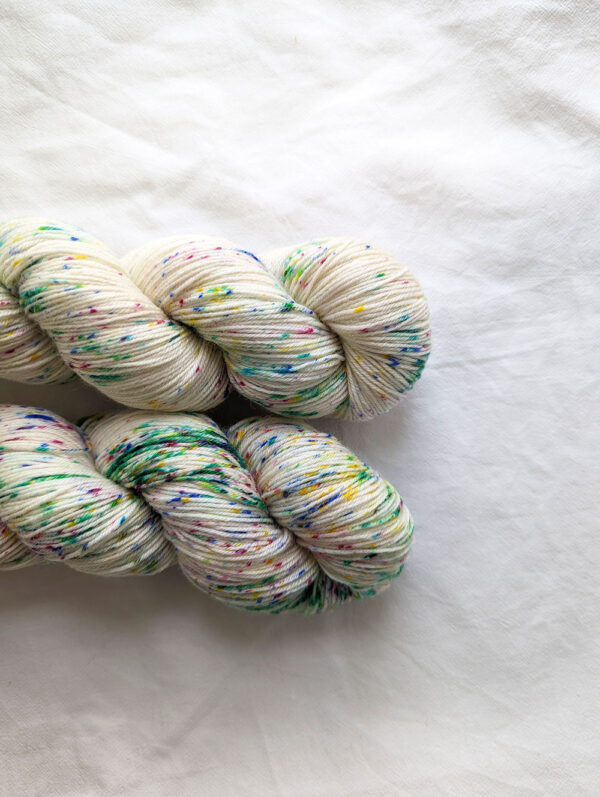 Two skeins of 4ply multicoloured speckled yarn