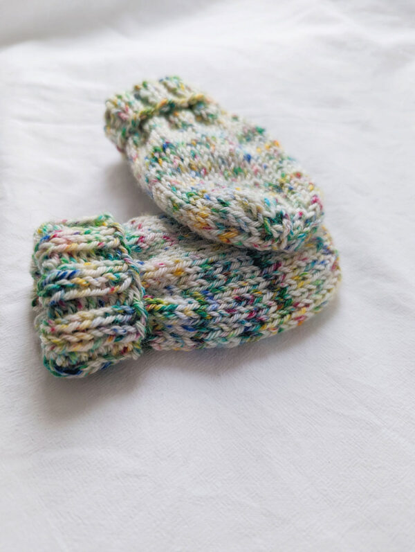 colourful simple baby mittens in confetti speckled hand dyed yarn