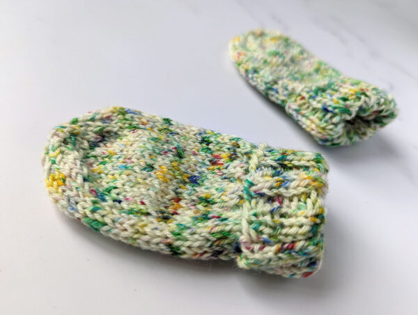 Multicoloured speckled knitted baby mittens
