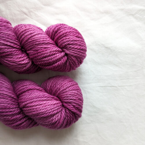 Two skeins of purple semi solid chunky hand dyed yarn