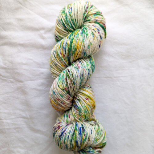 Skein of multicoloured speckled hand dyed yarn in DK weight