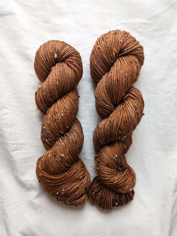 Two skeins of brown tweed DK yarn