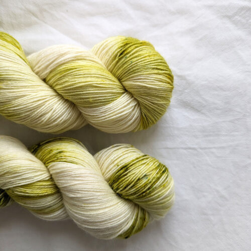 Two skeins of Olive Green speckled hand dyed yarn in 4ply weight