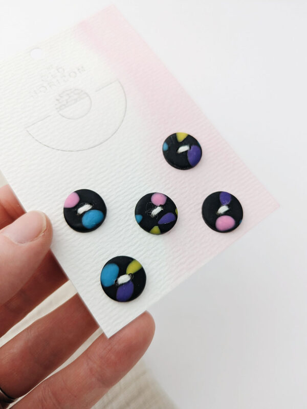 Black handmade 15mm buttons with colourful random patterns