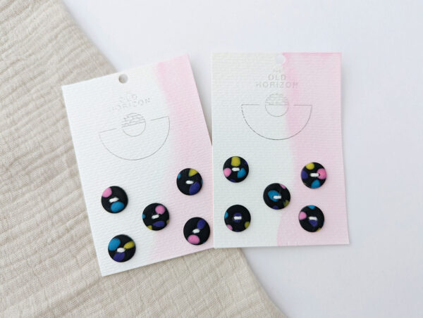 Sets of five black buttons handmade with confetti pattern in polymer clay