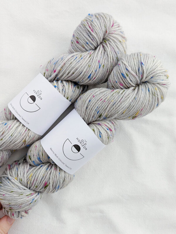Two skeins of grey multi coloured tweed yarn