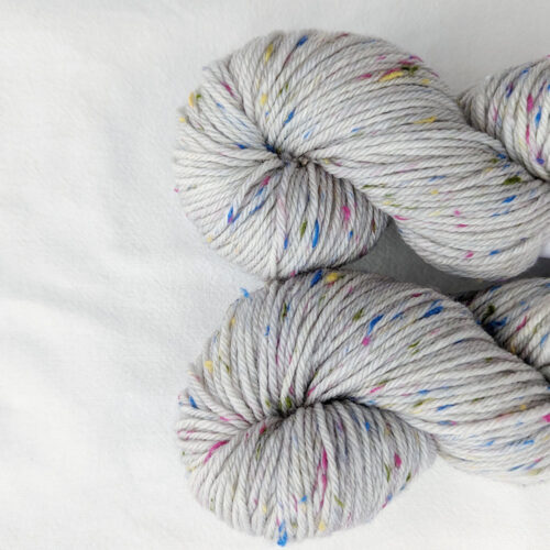 Grey yarn with multi coloured tweed specs in dk weight
