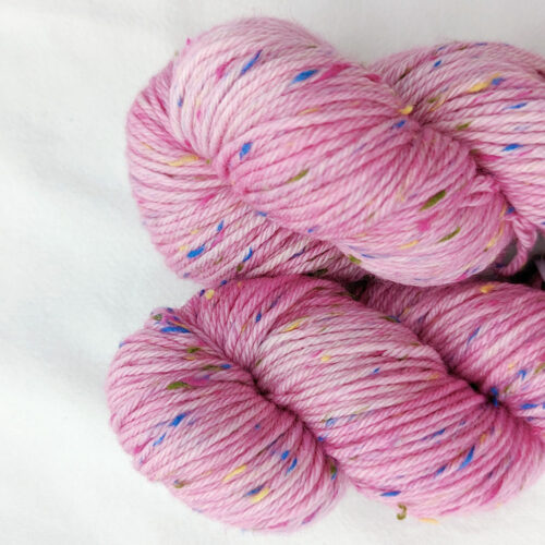 Two skeins of pink multi coloured tweed yarn in dk weight