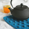 Thick felted potholder made from knitting pattern with bobbles in teal colour
